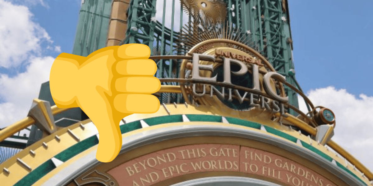 A large yellow thumbs-down emoji is superimposed over the entrance sign for Universal Epic Universe, obscuring part of the sign and suggesting a bust, with a blue sky and clouds in the background.