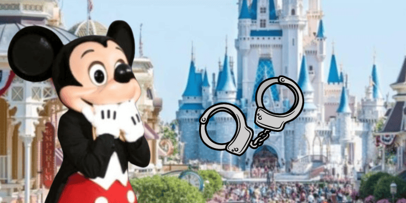 A person in a Mickey Mouse costume stands with hands near their face in front of a castle at a theme park, as an illustrated pair of handcuffs is superimposed beside them—hinting at Disney guest behavior that could get you kicked out.
