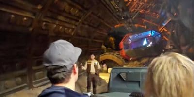 A Disney cast member talks to guests stuck on Star Wars: Rise of the Resistance.