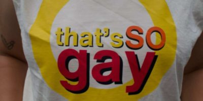 A person wearing a "that's so raven" parody shirt reading "that's so gay." Disney security questioned this outfit choice.
