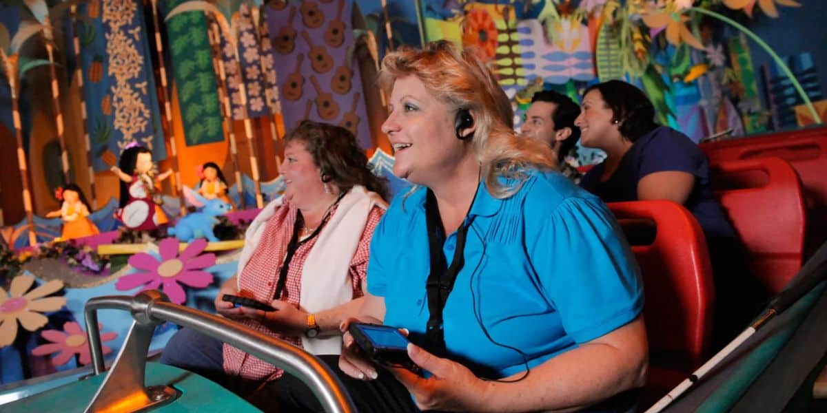 Disneyland Guests were audio headsets and ride "it's a small world"