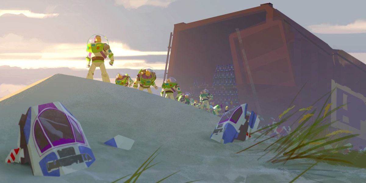 Several identical astronaut action figures stand in a line on a sandy hill near broken spacecraft parts, with an open shipping container filled with similar figures in the background under a cloudy sky.