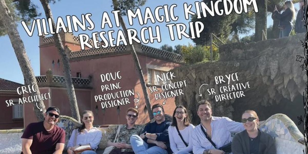 A group of eight people sits outdoors on a curved stone bench, smiling at the camera. Handwritten labels above them identify their names and creative roles on a "Villains at Magic Kingdom Research Trip.