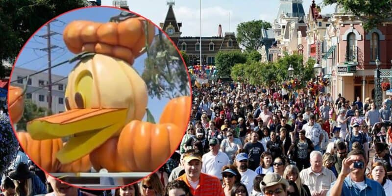 A large crowd walks down a parade street decorated for Halloween; inset shows a close-up of a Donald Duck pumpkin float with a large orange pumpkin on its head.