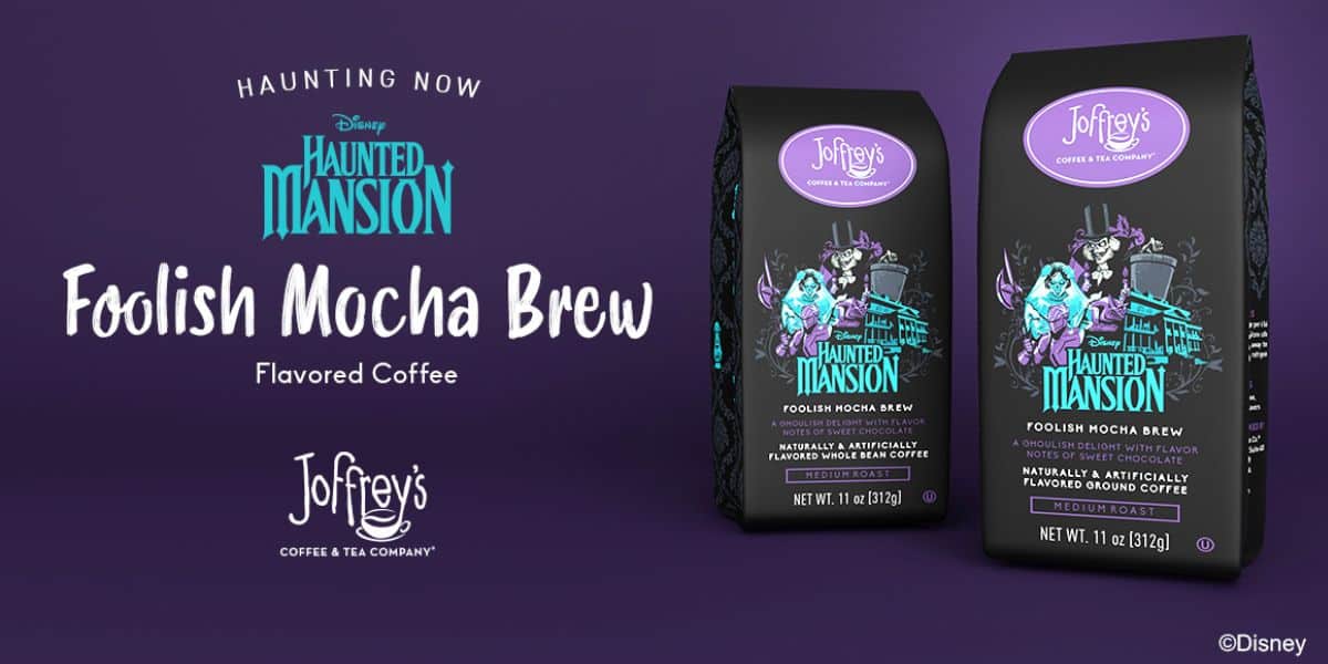 Promotional image for Joffrey’s Foolish Mocha Brew flavored coffee, themed after Disney’s Haunted Mansion. Two coffee bags with Haunted Mansion characters on a purple background highlight Destination D23 2025 exclusive finds. Text reads “Haunting Now.”.