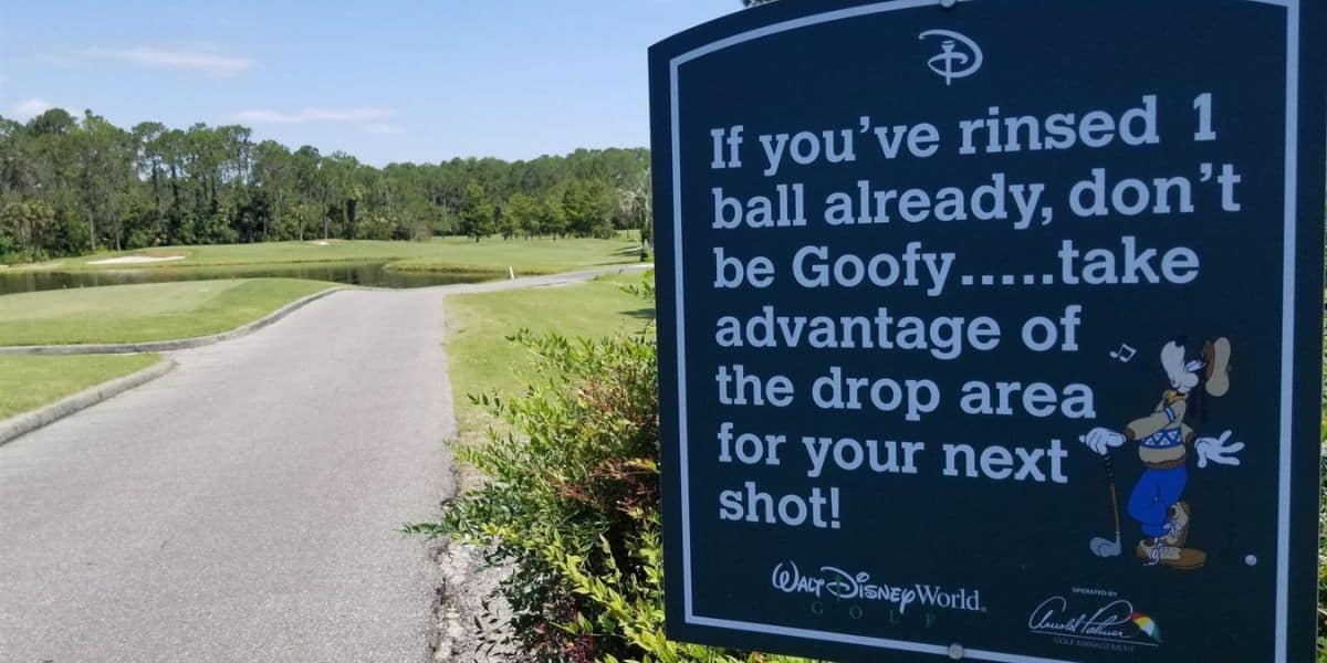 A golf course sign at Disney World reads: "If you’ve rinsed 1 ball already, don’t be Goofy... take advantage of the drop area for your next shot!" featuring Goofy and Walt Disney World Golf logos.