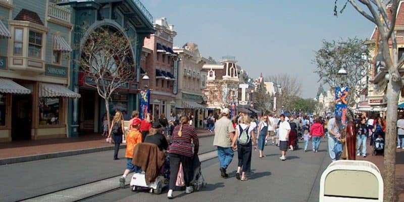 Crowds walking down Main Street, U.S.A. at Disneyland Park.