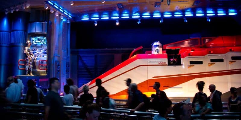 People walking through the Star Tours – The Adventures Continue queue at Disneyland