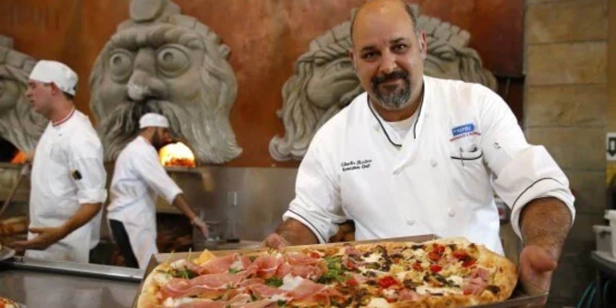 A chef and other workers at Via Napoli in EPCOT at Walt Disney World Resort.