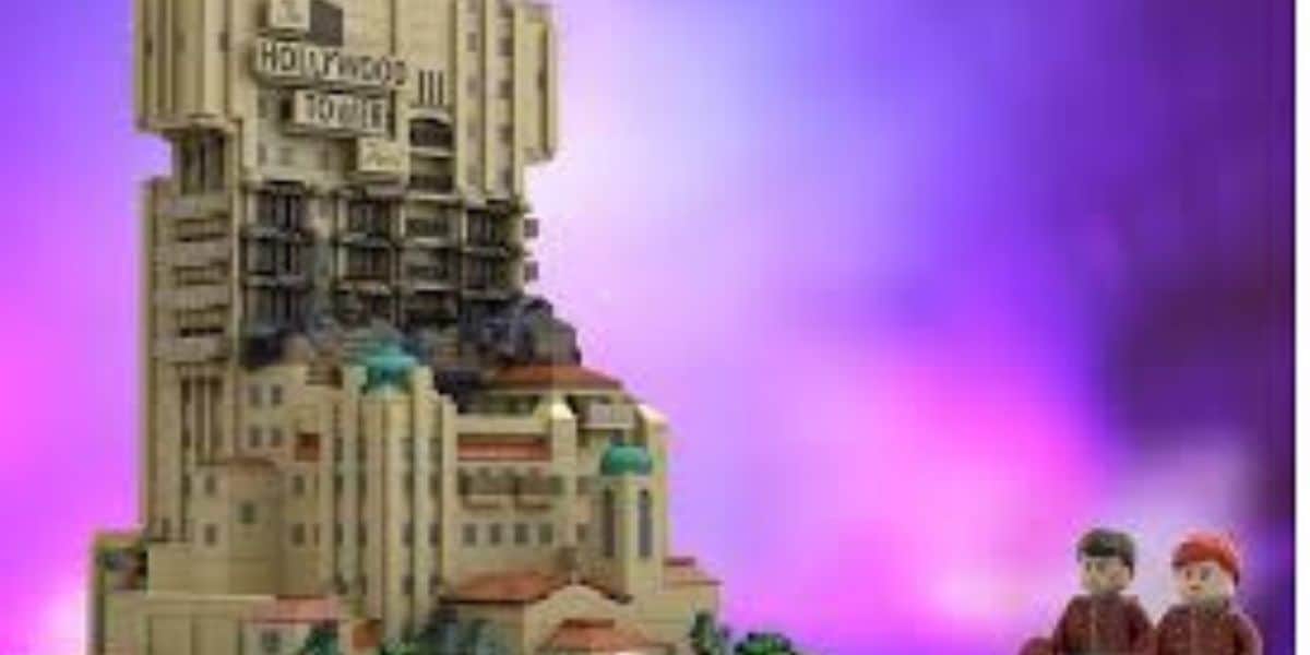 A LEGO model of the Hollywood Tower Hotel stands on the left, with two LEGO minifigures on the right, set against a bright purple and pink gradient background.