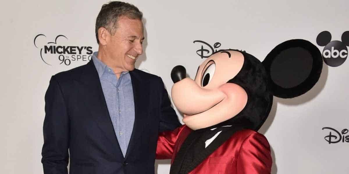 Mickey Mouse and Bob Iger smile.