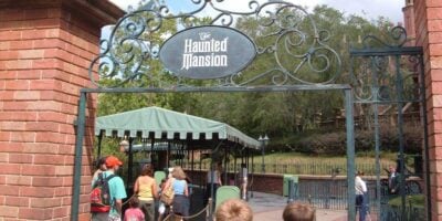 Visitors enter The Haunted Mansion attraction at Disney World