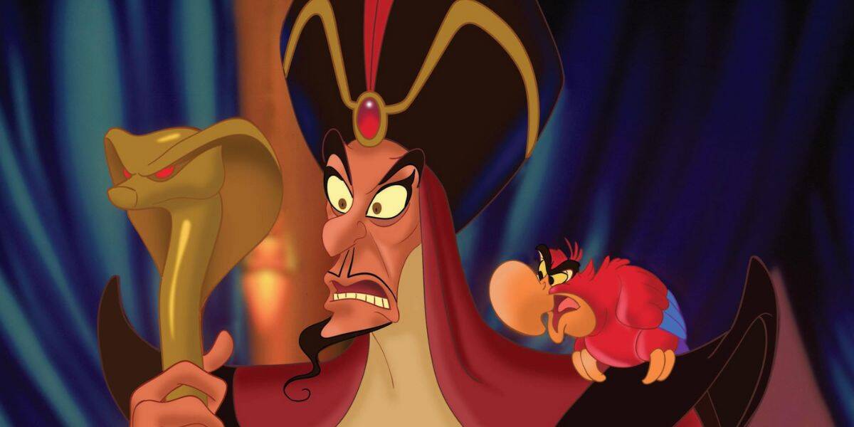 Animated villain Jafar, holding a golden cobra staff, looks angry; a red and blue parrot perches on his shoulder, also appearing annoyed. The dark blue background with hints of gold adds to the sinister vibe of these classic villains.