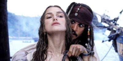 Jack Sparrow (Johnny Depp) holding Elizabeth Swann (Keira Knightley) at knifepoint in 'Pirates of the Caribbean'