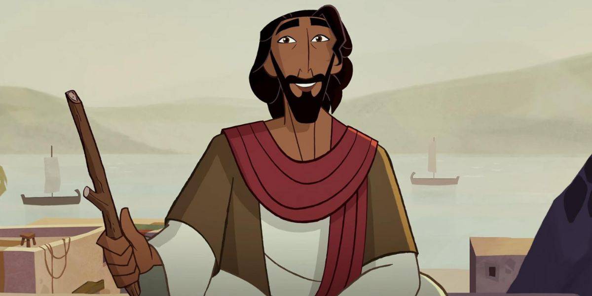 An animated man with dark hair and a beard, designed in the style of Tom Bancroft, wears a red sash and holds a wooden staff as he stands near water with boats and distant hills in the background, smiling warmly.