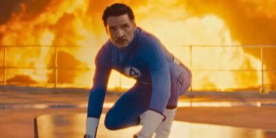 Pedro Pascal as Reed Richards/Mister Fantastic with an explosion behind it