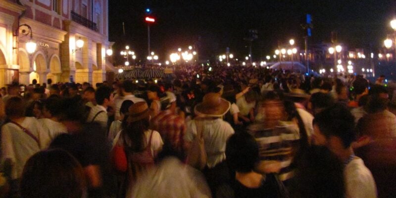 A crowd of guests in the dark at Tokyo DisneySea