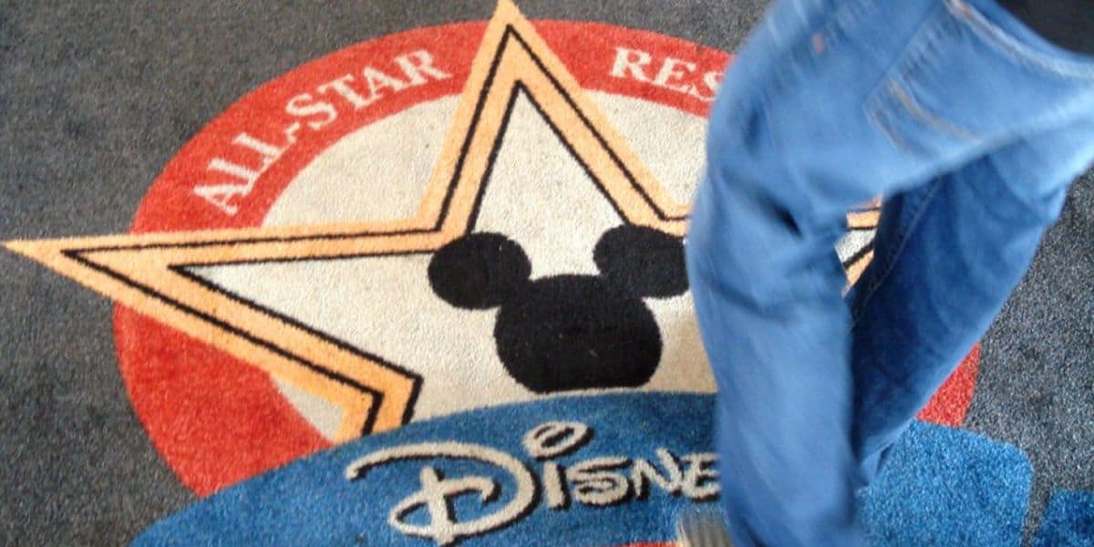 A carpet with the All-Star Resorts logo at Disney's All-Star Music Resort.