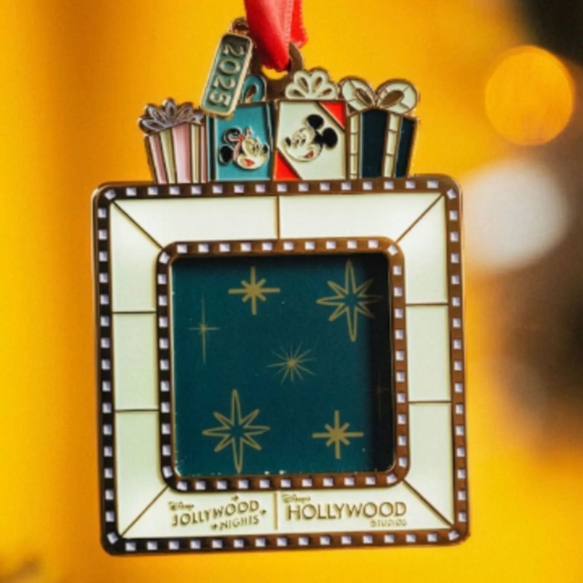 A festive Disney ornament inspired by a Hollywood marquee, featuring Mickey Mouse, gifts, and "2023" on top. The frame highlights "Jollywood Nights" and "Hollywood Studios" at the bottom for an extra touch of holiday magic.