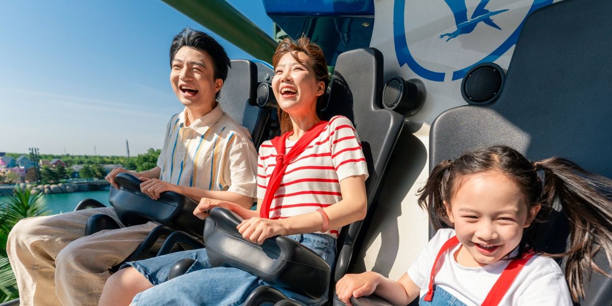 Guests ride Jurassic Flyers at Universal Studios Beijing