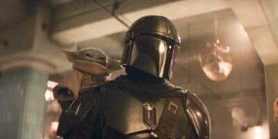 The Mandalorian (Pedro Pascal) and Grogu on his shoulder