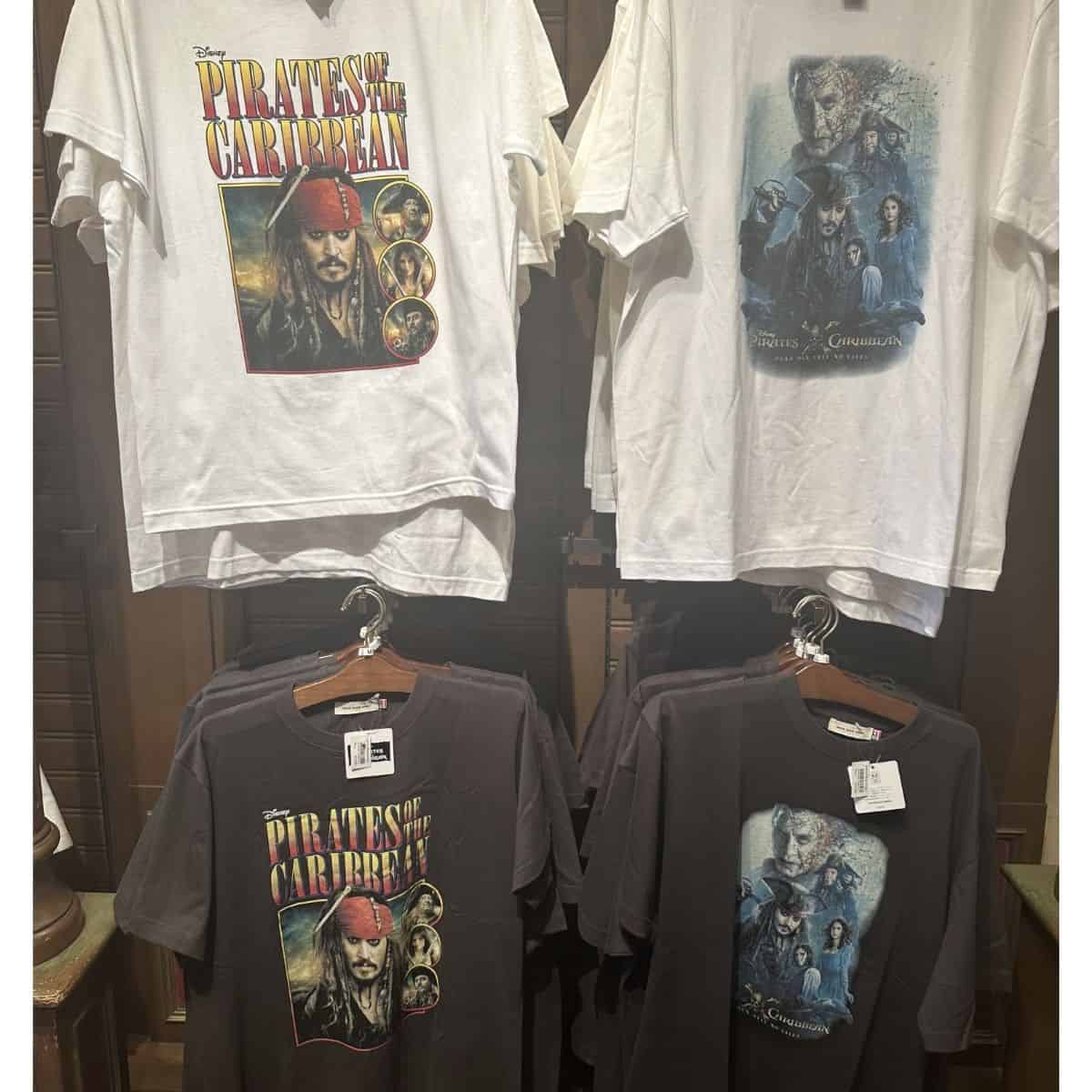 Four “Pirates of the Caribbean” t-shirts on display. All feature Johnny Depp as Captain Jack Sparrow