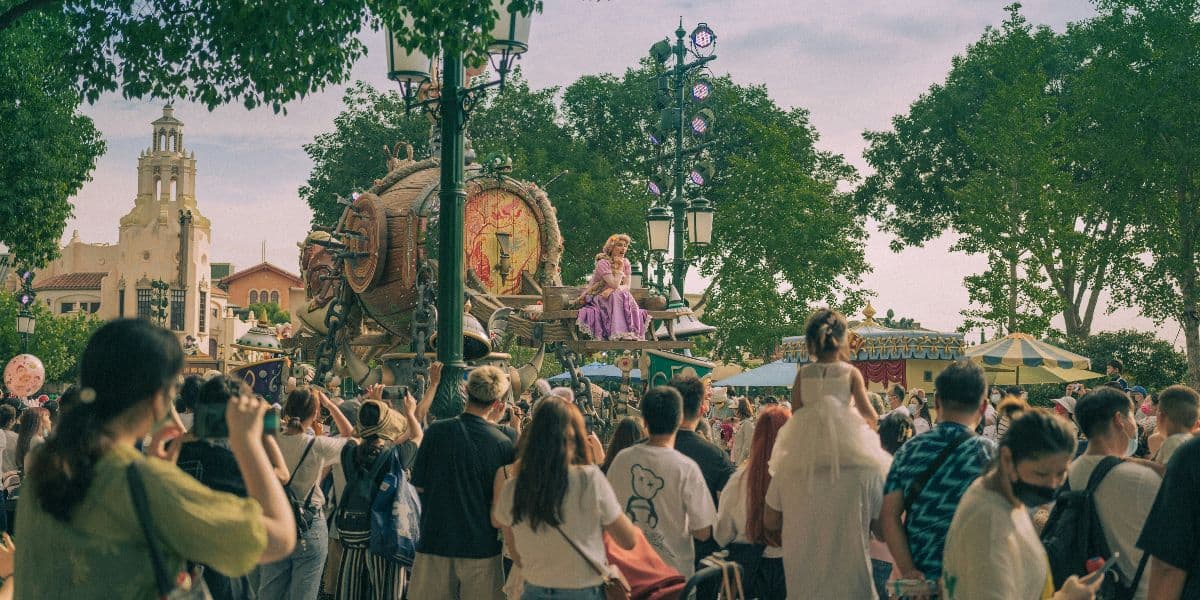 A crowd watches a 'Tangled' parade float at Shanghai Disneyland