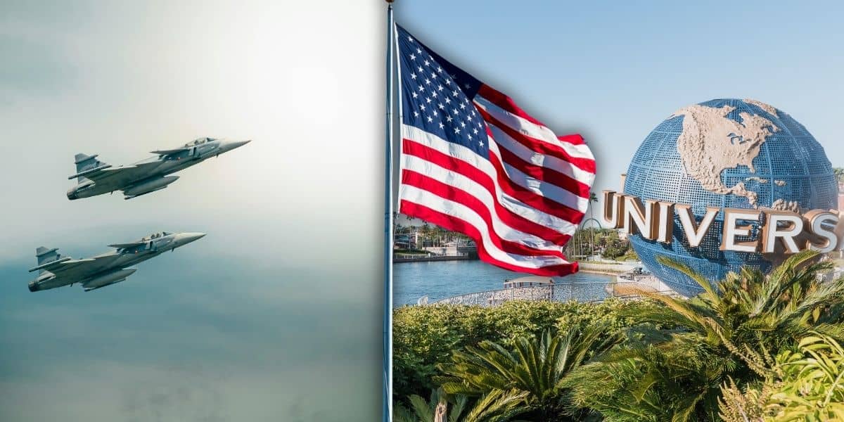 Two fighter jets flying in the sky are shown on the left, while on the right, a large American flag waves near the Universal Globe at Universal Studios Orlando Resort, surrounded by greenery under a blue sky.