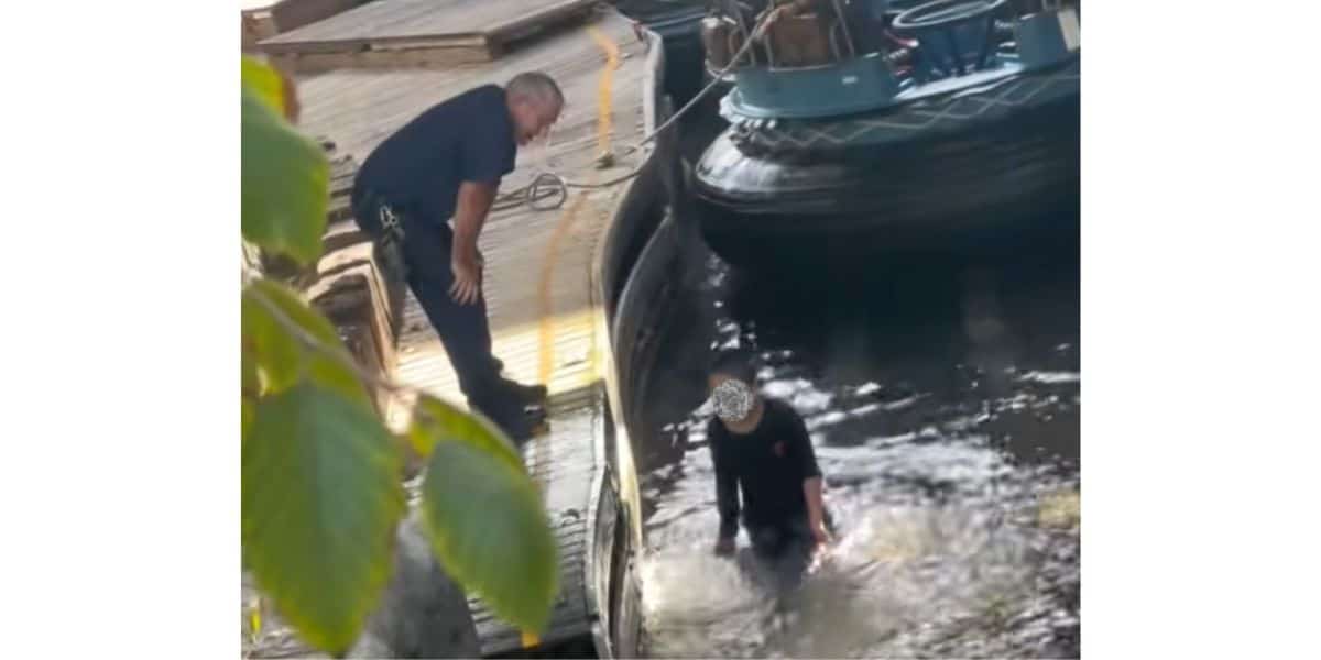 A child swimming in the ride water in Grizzly River Run at Disneyland Resort.