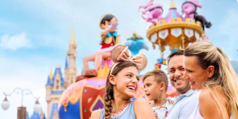 Family standing in front of the Festival of Fantasy parade at Magic Kingdom