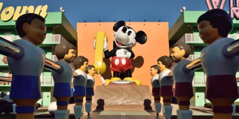 The Mickey Mouse phone statue and giant foosball field at Disney's Pop Century Resort.
