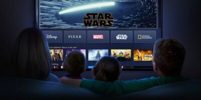 A family sits and watches the 'Star Wars' landing page on Disney+