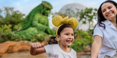 young girl and mom in Disney World's EPCOT park with Te Fiti in the background