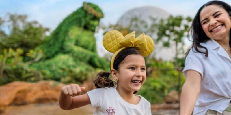 young girl and mom in Disney World's EPCOT park with Te Fiti in the background