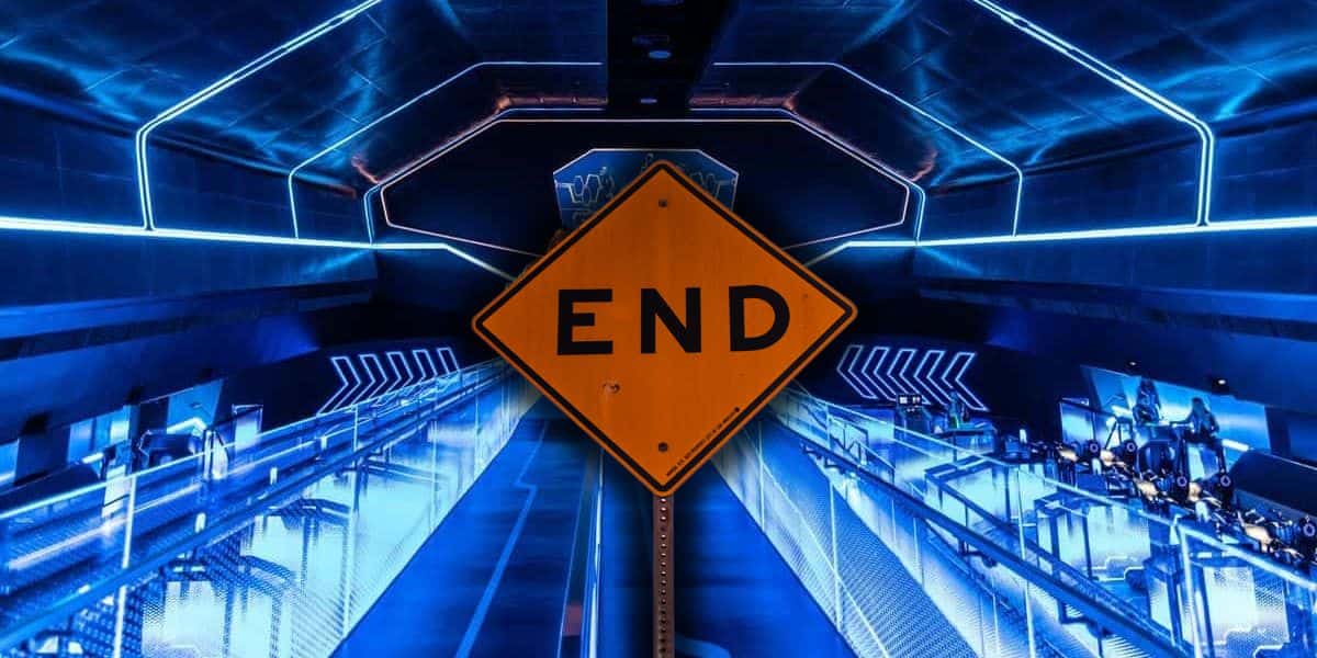 A bold yellow "END" sign welcomes guests at the entrance to the Tron Lightcycle / Run attraction inside of Magic Kingdom at Disney World.