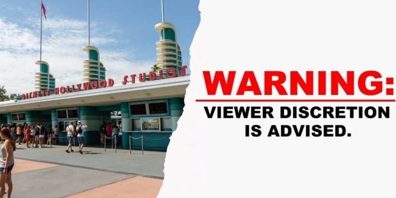 Disney's Hollywood Studios entrance with a bold "WARNING: Viewer discretion is advised" sign displayed beside the gates, after a Disney World cast member was nearly crushed by a prop during a live show.