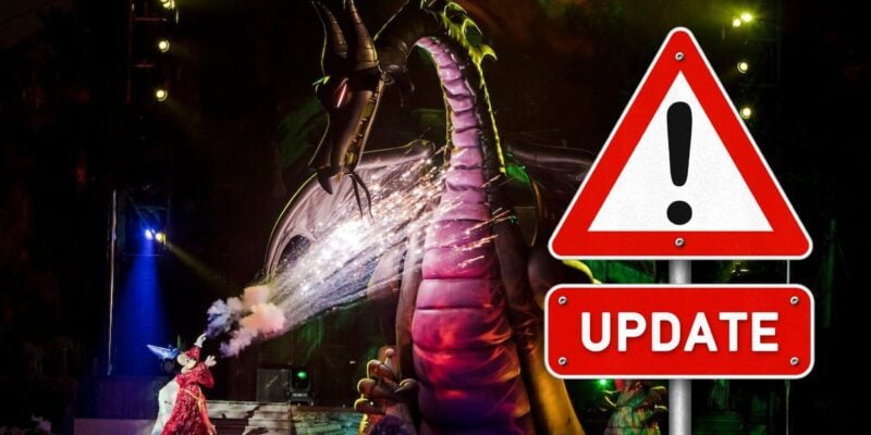 On stage, a performer bravely confronts a fire-breathing dragon; an "UPDATE" caution sign stands at the front of the show inside Disney World, Hollywood Studios.