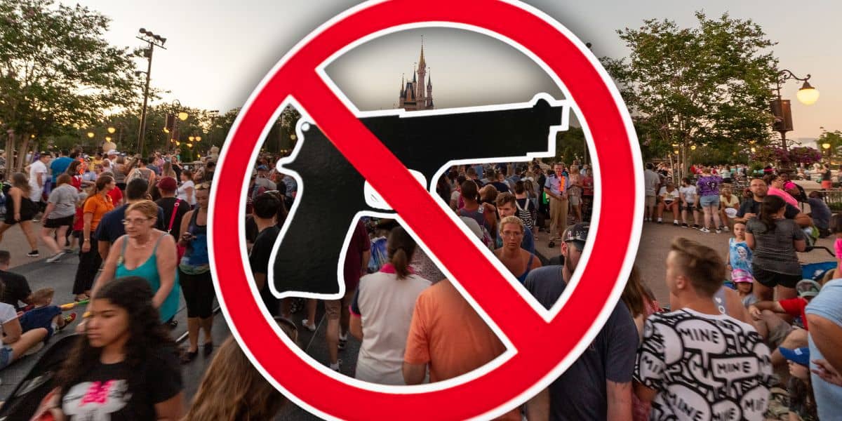 A prominent "no guns" icon displayed above a bustling Magic Kingdom Disney World theme park crowd, highlighting the entertainment venue’s safety policy.