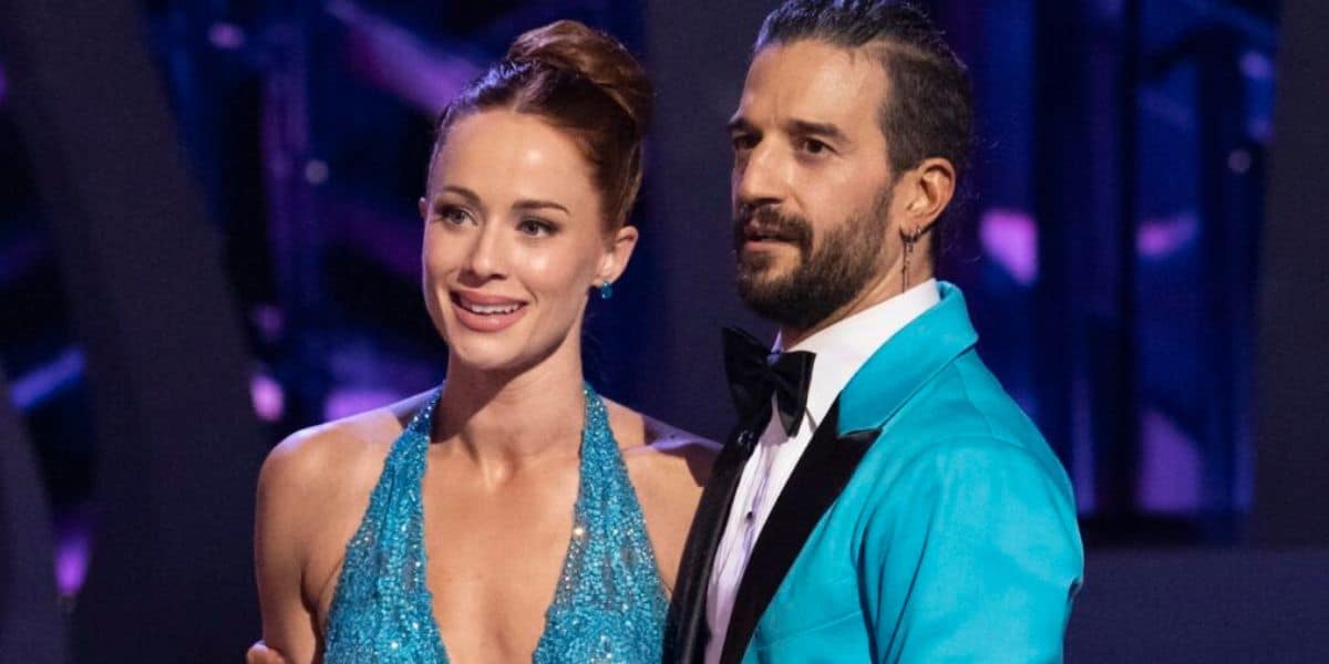 Whitney Leavitt, beaming joyfully as she poses before a classic backdrop for Dancing with the Stars
