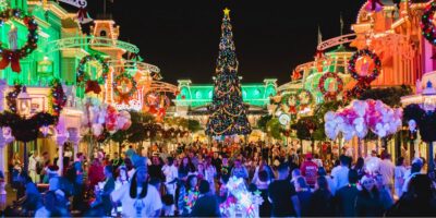 huge crowds flood streets of Main Street during Christmas time in Disney World