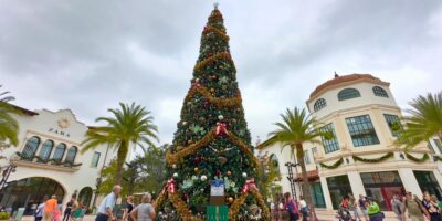 A festive Christmas tree glows at Disney Springs.