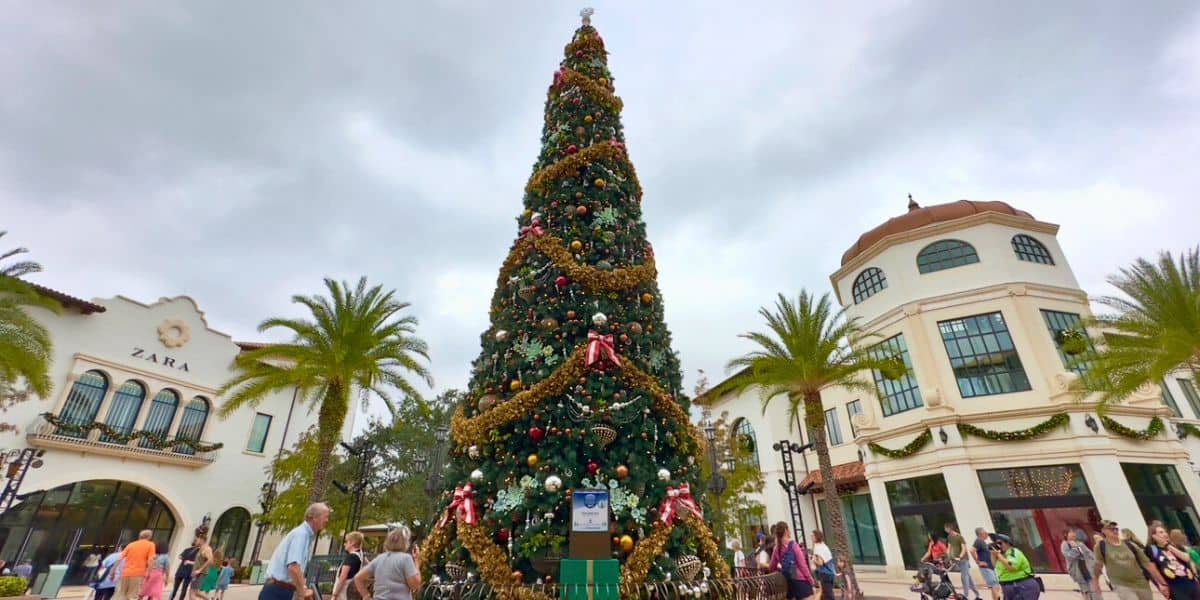 A festive Christmas tree glows at Disney Springs.