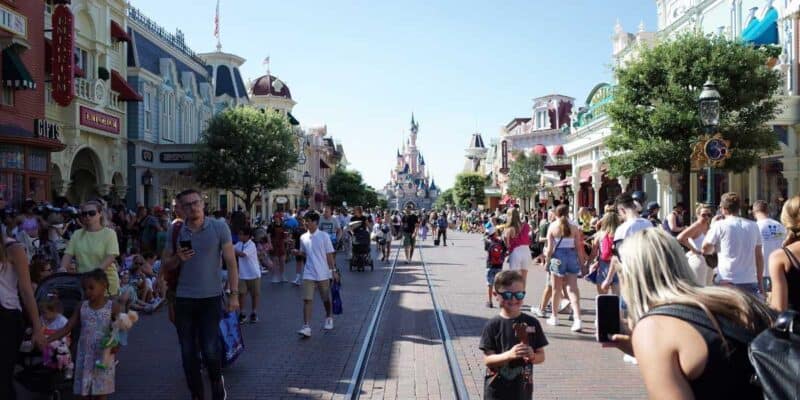 Guests stroll down Main Street, U.S.A. at Disneyland Paris