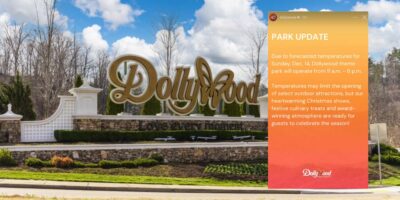 Dollywood entrance sign announces adjusted park hours and limited attractions because of chilly winter weather.