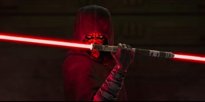 Darth Maul wields his double-bladed red lightsaber