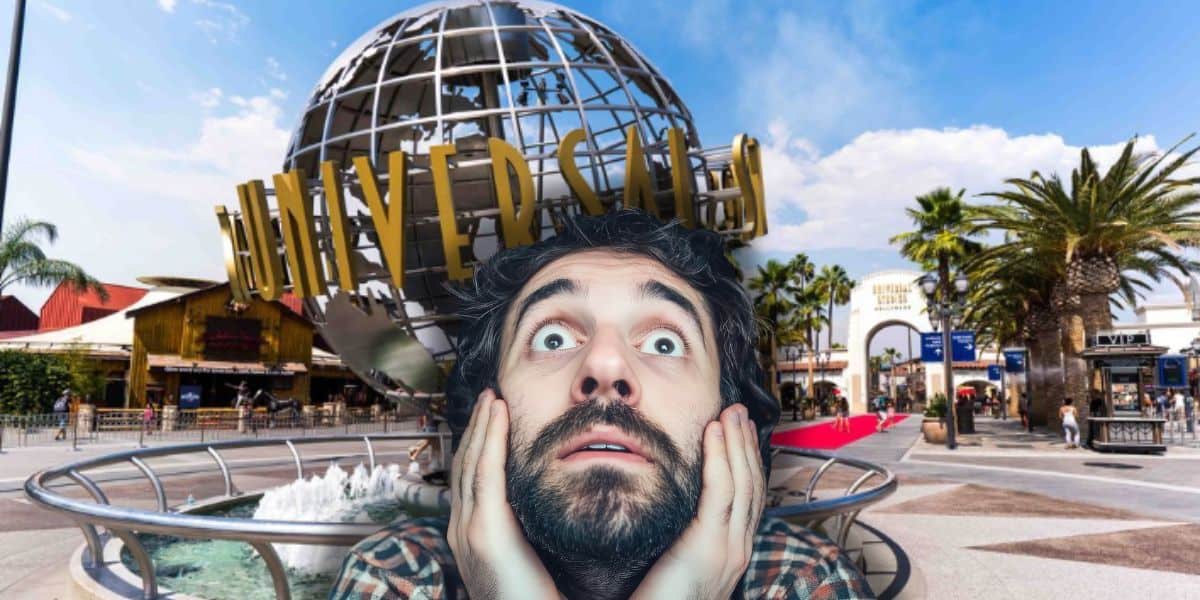 A surprised guest poses in front of the iconic Universal Studios Hollywood globe, ready for adventure on a bright, sunny day as an iconic closure takes place.
