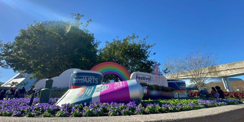 Epcot International Festival of the Arts features a giant paint tube, rainbow art, and flowers—an interactive Disney experience.
