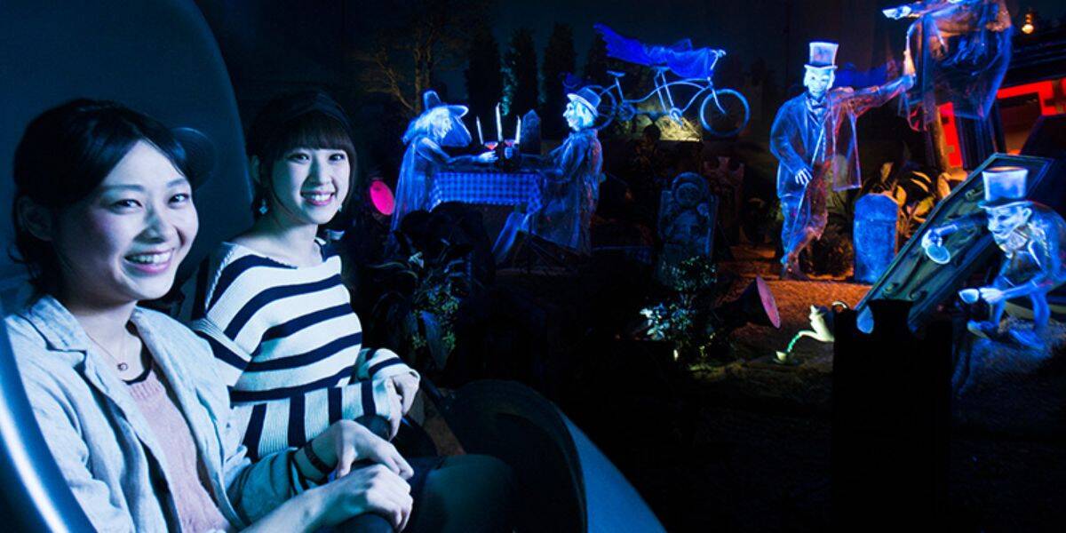 Guests enjoy the Haunted Mansion ride at Tokyo Disneyland
