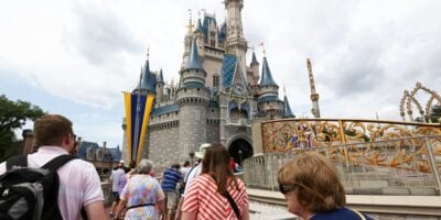 Guests approaching Cinderella Castle at Magic Kingdom Park