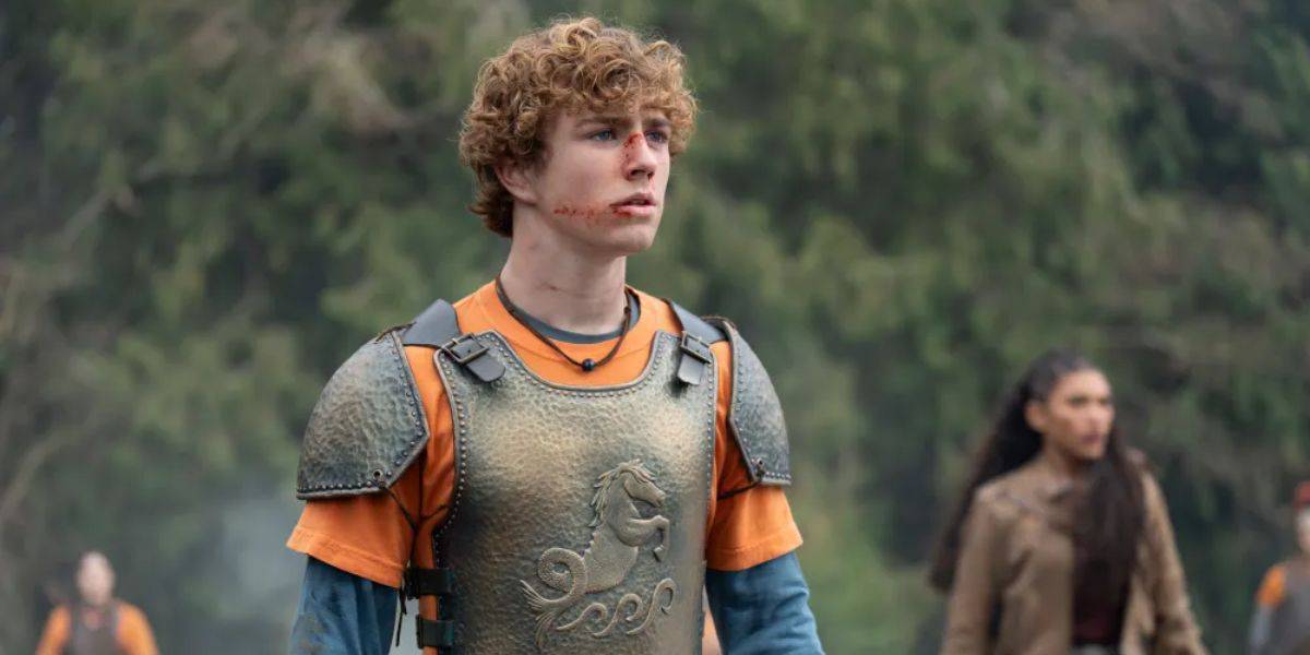 Percy Jackson in armor with Clarisse in the background